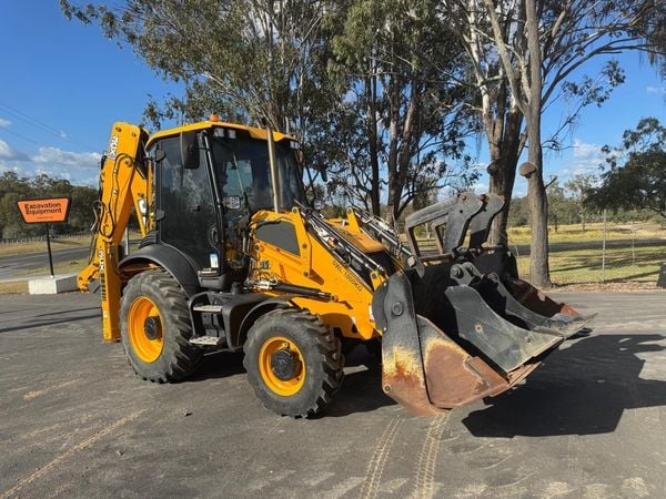 a yellow backhoe loader